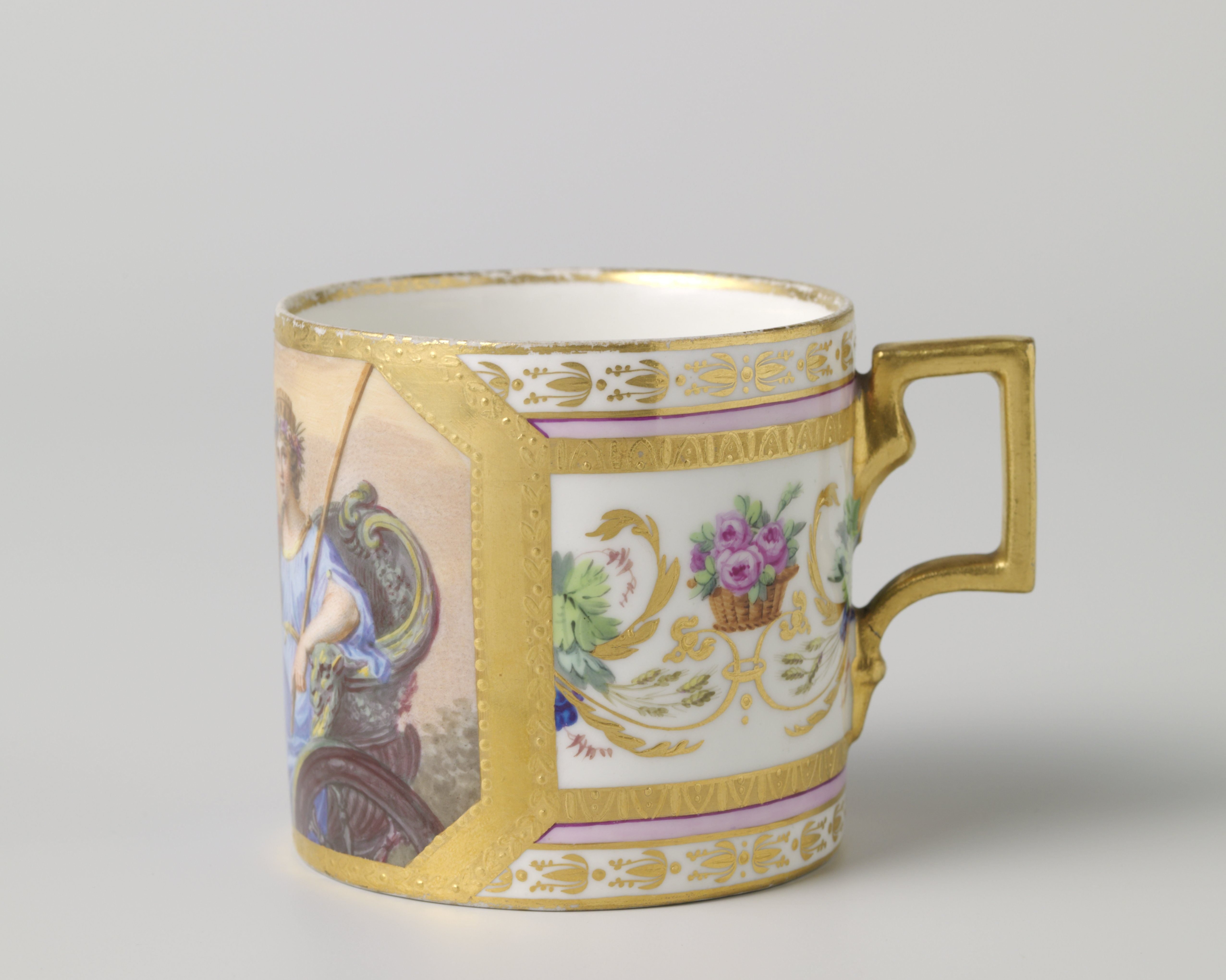 Porcelain cup with a cylindrical body and angular handle, painted over the glaze in enamel colors and gold.
